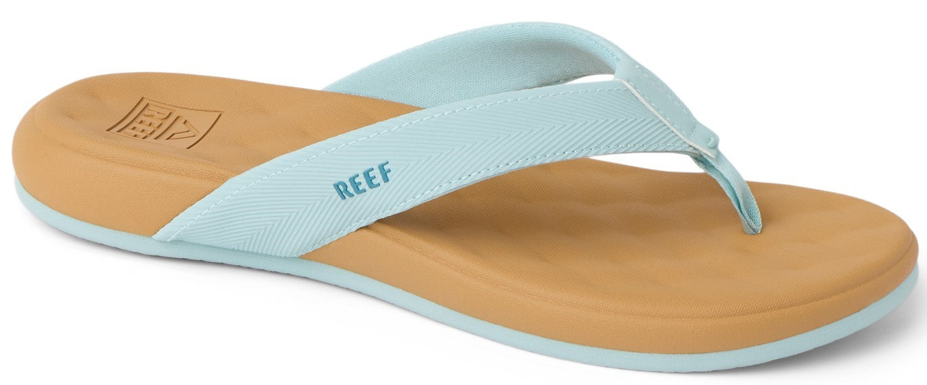 A tan and blue sandal.