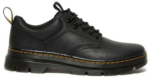 Low-cut, black leather shoe with lug sole and yellow stitching.