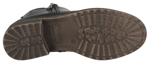 The sole of a shoe. The sole has a lot of treads. There is a logo that says "Tamaris".
