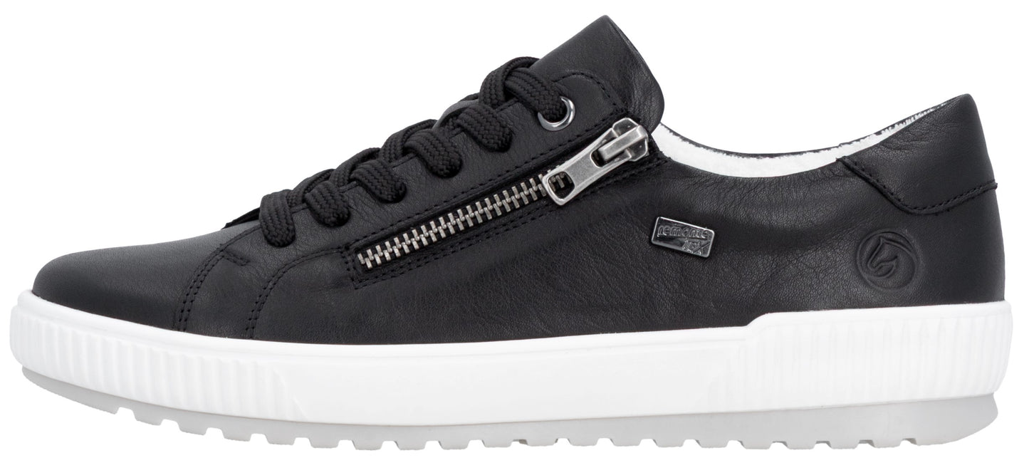 Black sneaker with laces and side zipper on a white sole.