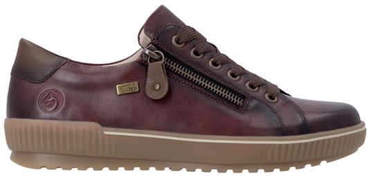 A maroon leather sneaker with a side zipper, brown laces, a brown rubber sole with a textured ribbed sidewall, and a logo embossed on the heel area.