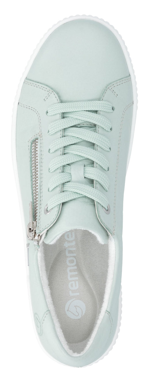 Pale green sneaker with side zipper and white sole.