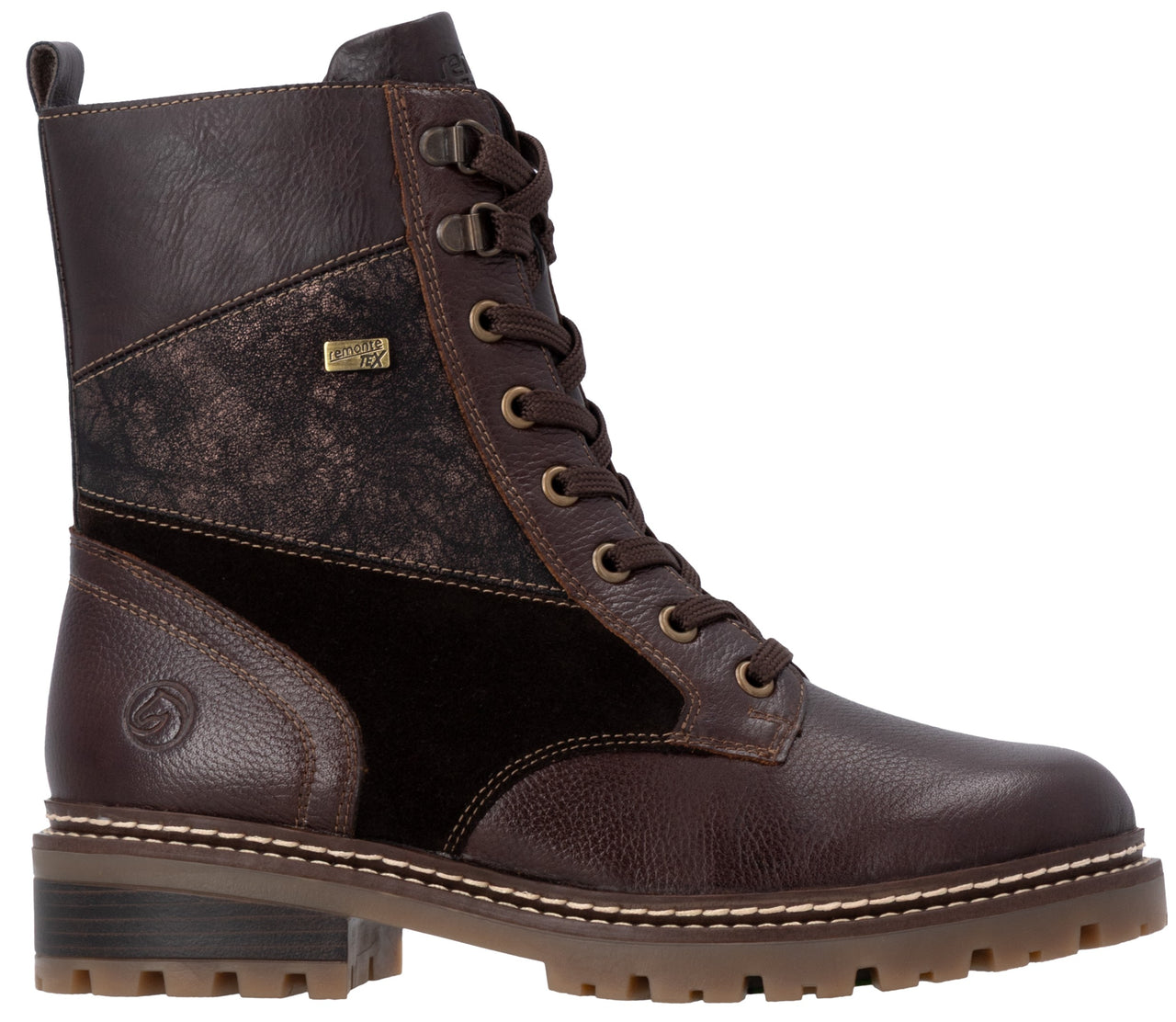 A brown lace-up combat-style ankle boot featuring a mix of textures including smooth leather, pebbled leather, and a dark patterned fabric panel on the side, finished with a rugged, thick-treaded sole.