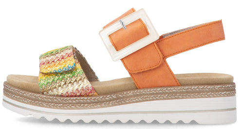 Orange sandal with a colorful woven strap and a white square buckle.