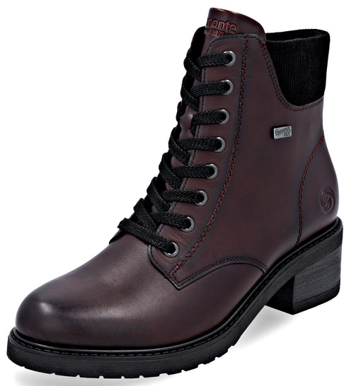 A maroon lace-up women's ankle boot with a black block heel, a black lug sole, black laces, and a black knit collar at the top of the ankle.