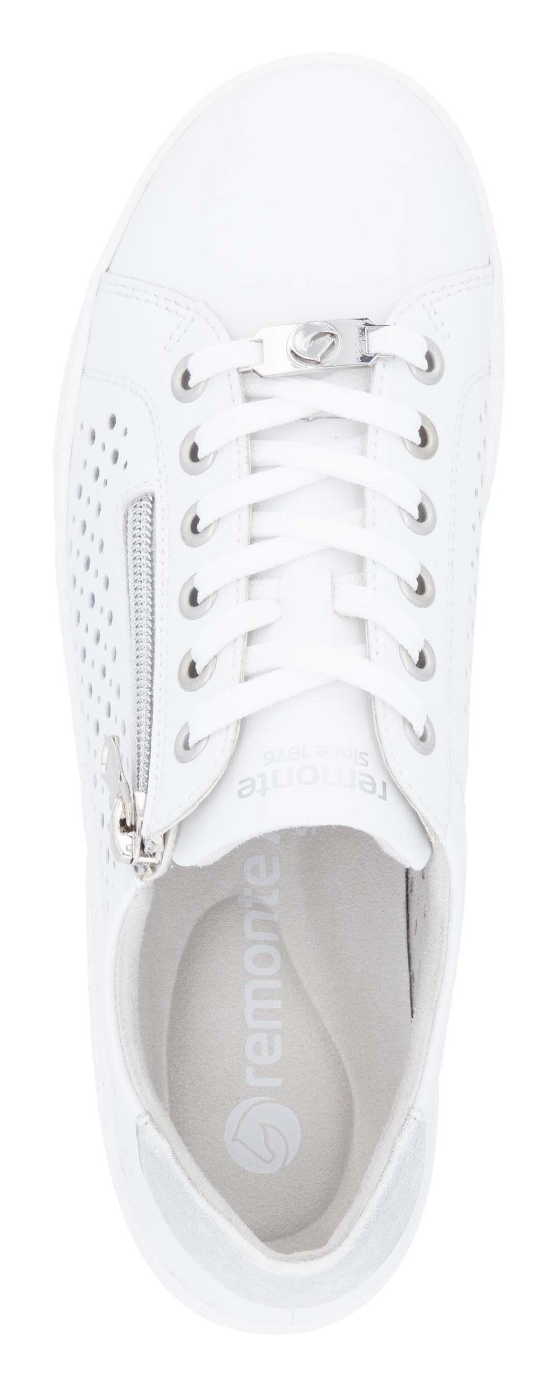 A white sneaker with laces and a zipper on the side.