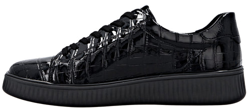 A black sneaker made of patent leather with a textured, crocodile-skin pattern, featuring black laces and a thick, ridged black rubber sole.
