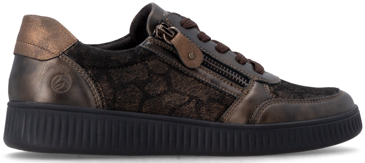 A brown, low-top sneaker with a textured metallic finish and black laces, featuring a side zipper, a bronze-colored heel tab, a dark patterned fabric side panel, and a black ridged sole.