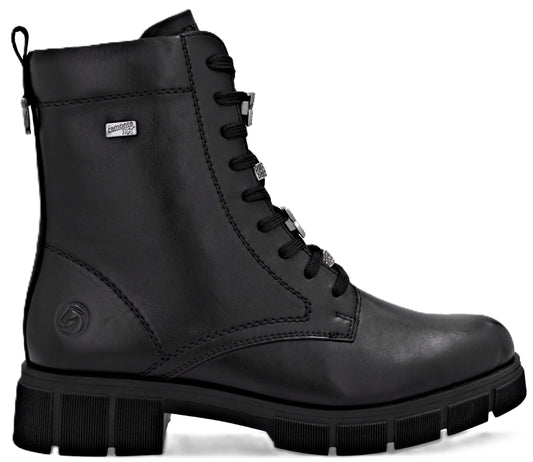 Black leather combat boot with lace-up closure and chunky lug sole.