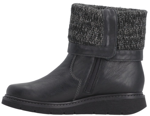 A black ankle boot with a smooth leather lower portion, a side zipper, and a textured, knitted charcoal grey cuff at the top, set on a dark, flat, textured sole.