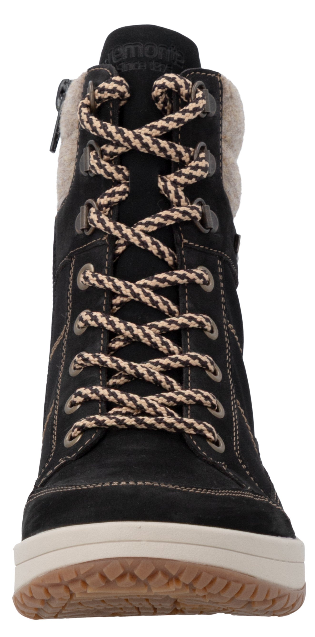A black, lace-up winter boot with a beige, fuzzy trim around the collar and a thick white midsole with a textured tan outsole, featuring brown and white patterned laces.