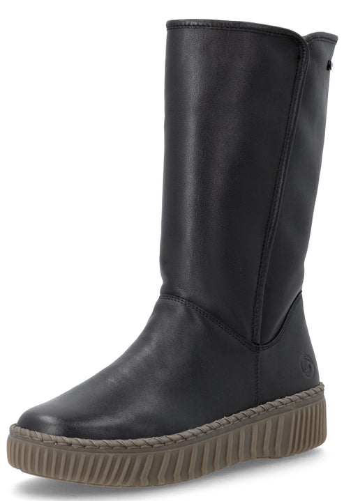 A black calf-length boot with a smooth leather-like upper and a thick, textured, medium-brown platform rubber sole with a stitched trim detail.