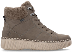 A taupe-colored mid-top sneaker boot with a sherpa-lined collar, lace-up front with metal eyelets, and a thick, ribbed, cream-colored platform sole with decorative stitching along the welt.