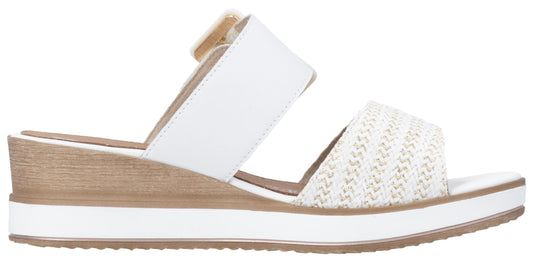 White wedge sandals with textured strap.