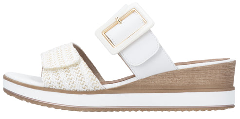 Sandals with white woven strap and adjustable white buckle strap on a white platform sole.