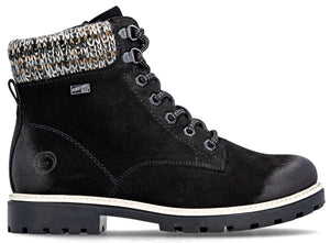 Black ankle-high boot with a white sole and multicolored knit lining.