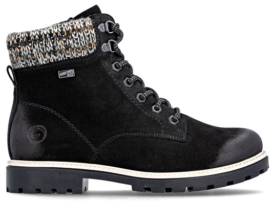 Black ankle-high boot with a white sole and multicolored knit lining.