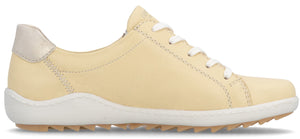 A low top, yellow casual shoe with a white sole and laces.