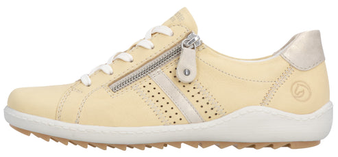 A low-top beige sneaker with laces and a side zipper.