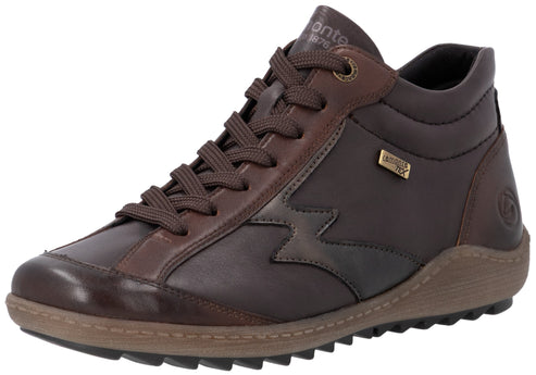 A brown leather ankle-height sneaker featuring brown laces, a light brown textured midsole with a sawtooth tread, and a small metallic label reading 'JOMONTE TEX' on the side.