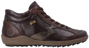 A brown leather ankle-height sneaker with dark brown laces, a side zipper, a light brown textured sole, and a metallic emblem on the side.