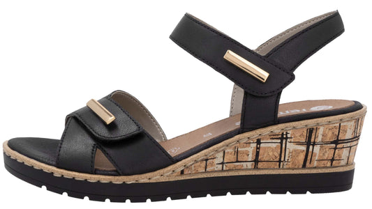 Black sandal with wedge heel and adjustable velcro straps.