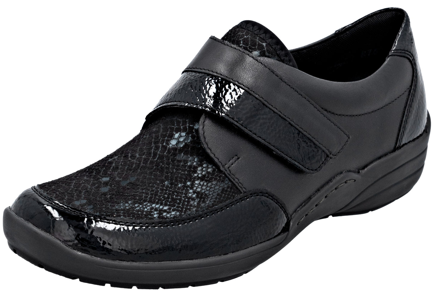 A black orthopedic-style women's shoe with a textured, snake-skin pattern on the toe and a glossy patent leather toe cap and velcro strap closure.