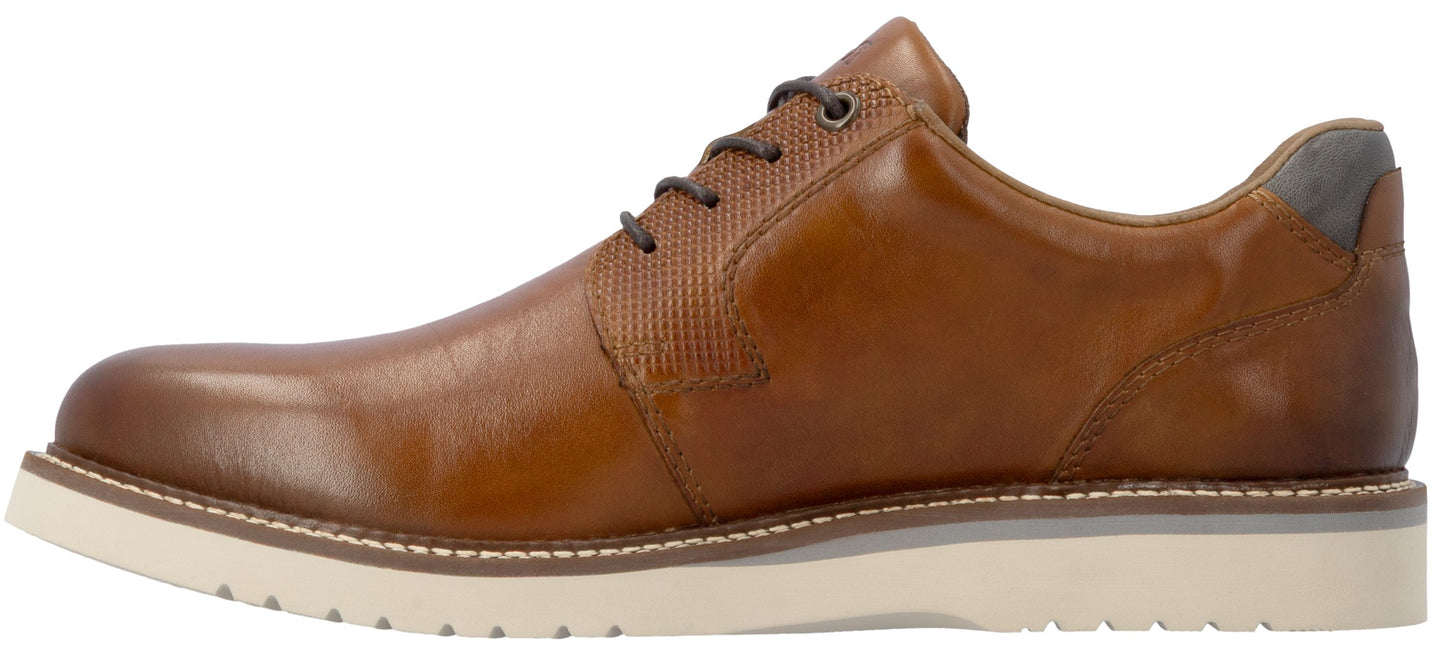 A brown leather men's dress shoe with a side-profile view, featuring dark laces, a textured leather panel around the lacing area, a small grey accent on the heel, and a thick, white, grooved rubber sole.