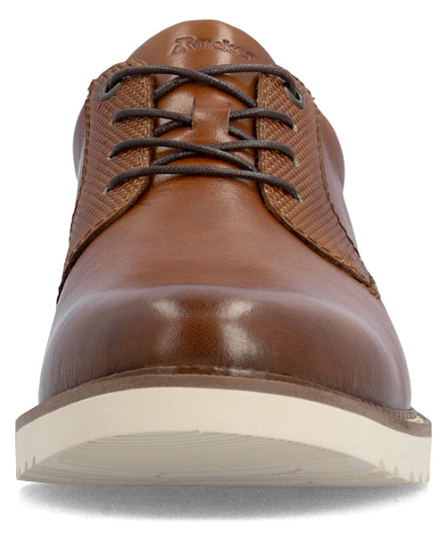 Front view of a brown leather lace-up shoe with a white rubber sole and woven textured side panels.
