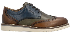 A tri-color leather dress shoe with a white sole and brown laces.