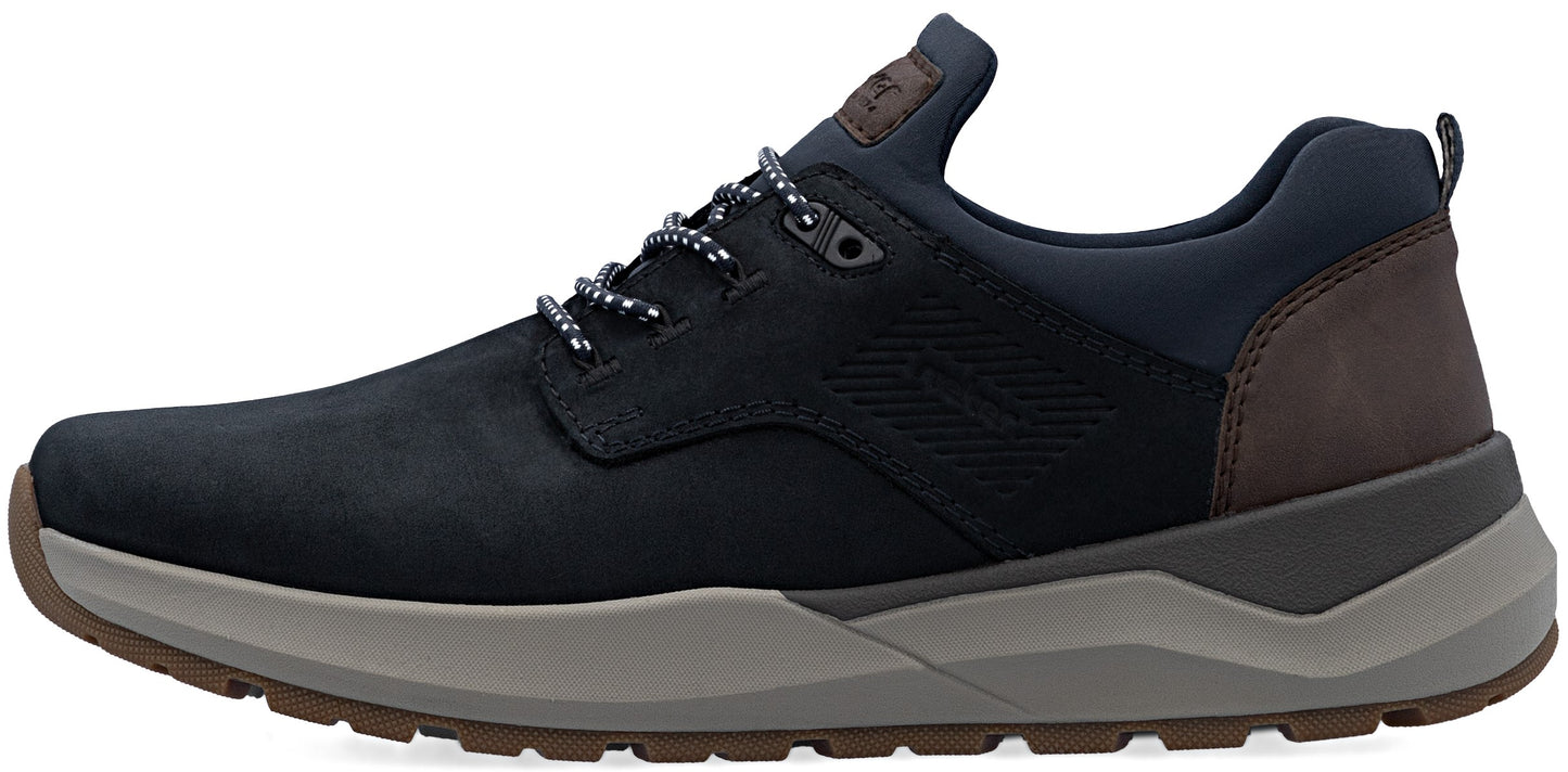 A side view of a navy blue sneaker with dark brown heel panel, gray midsole, and brown rubber outsole, featuring textured side paneling, dark blue laces, and a branded tongue label.