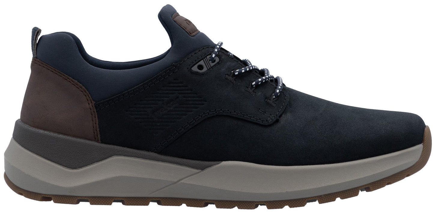 A low-top men's sneaker in dark navy blue leather and synthetic material, featuring a brown leather heel panel, a thick grey midsole, and a brown rubber outsole with patterned laces.
