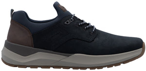 A low-top men's sneaker in dark navy blue leather and synthetic material, featuring a brown leather heel panel, a thick grey midsole, and a brown rubber outsole with patterned laces.