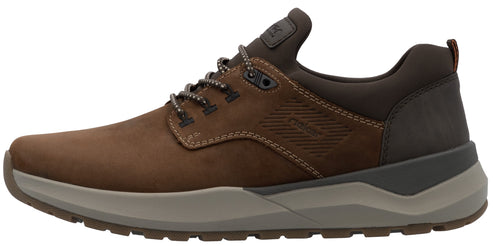 A brown leather casual sneaker with a thick, two-toned grey rubber sole, dark brown collar, matching brown laces, and subtle embossed logo detail on the side.