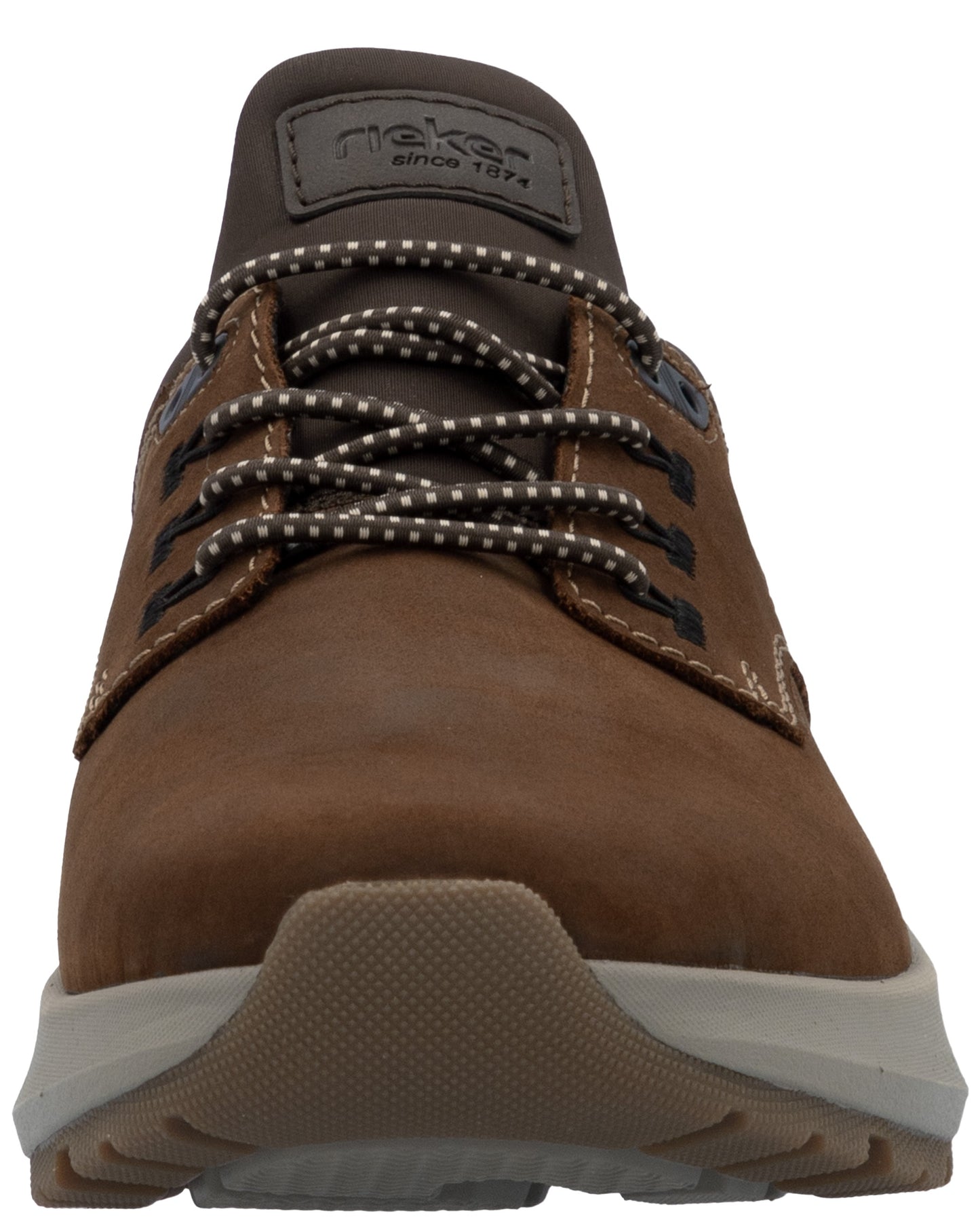 A brown leather casual shoe with a beige, textured rubber sole and dark brown patterned laces, featuring a tongue patch that reads rieker since 1874.