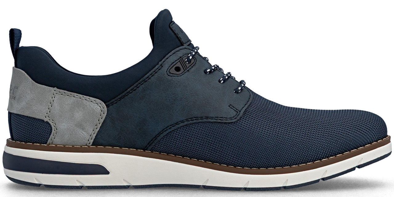 A dark blue low-top sneaker with matching laces and a white sole.