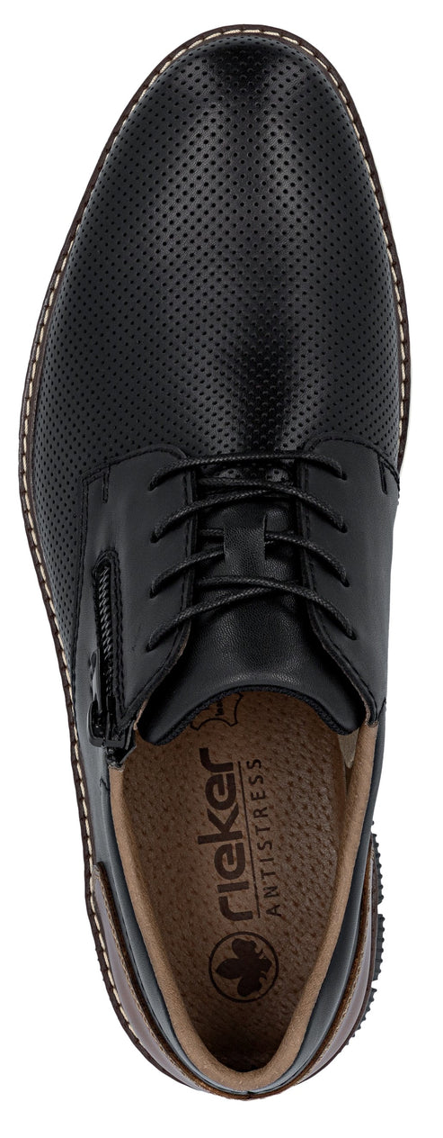 A black shoe with brown insoles and black laces.