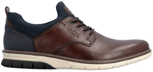 A brown leather and dark blue fabric casual shoe with a lace-up closure and a white and black rubber sneaker-style sole, featuring the brand name rieker embossed on the side.