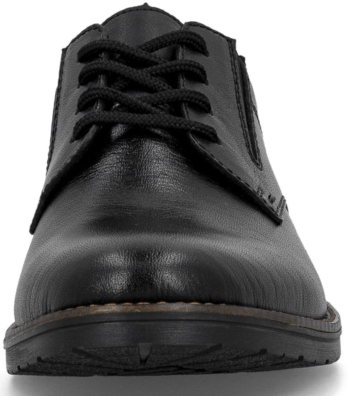 A close-up, front-facing view of a black men's leather derby shoe with black laces.