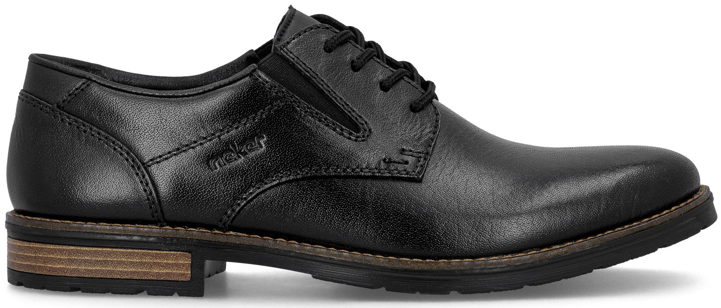 A black leather men's dress shoe with black laces and a brown and black layered heel.