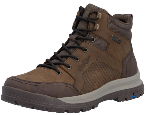 A brown lace-up hiking-style ankle boot with a rugged grey midsole, textured side panels, metal eyelets, and the word 'rieker' embossed on the side.