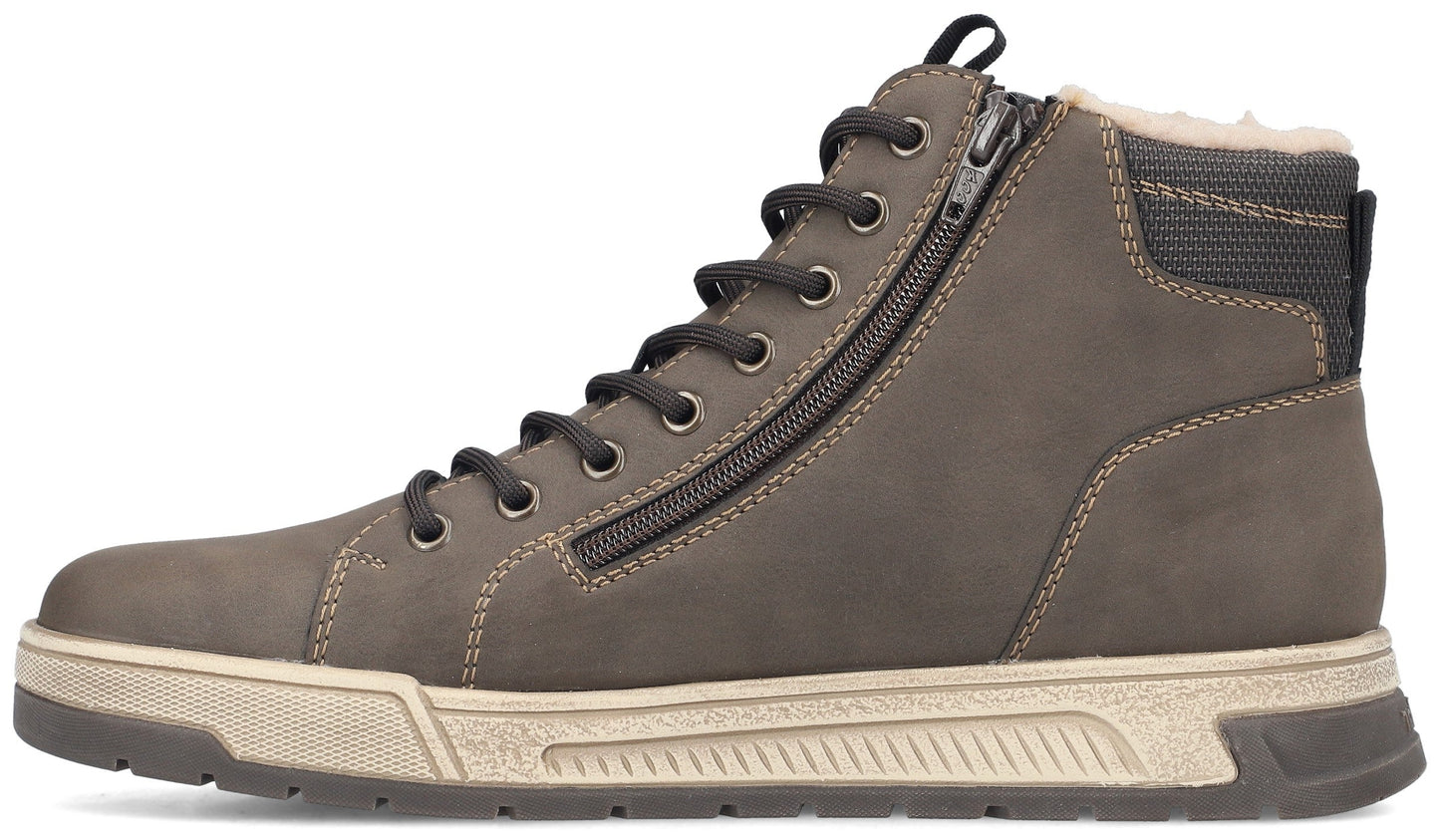 A brown high-top sneaker boot with a beige textured midsole, a dark brown outsole, lace-up front, a side zipper, and a faux-fur lining visible at the collar.