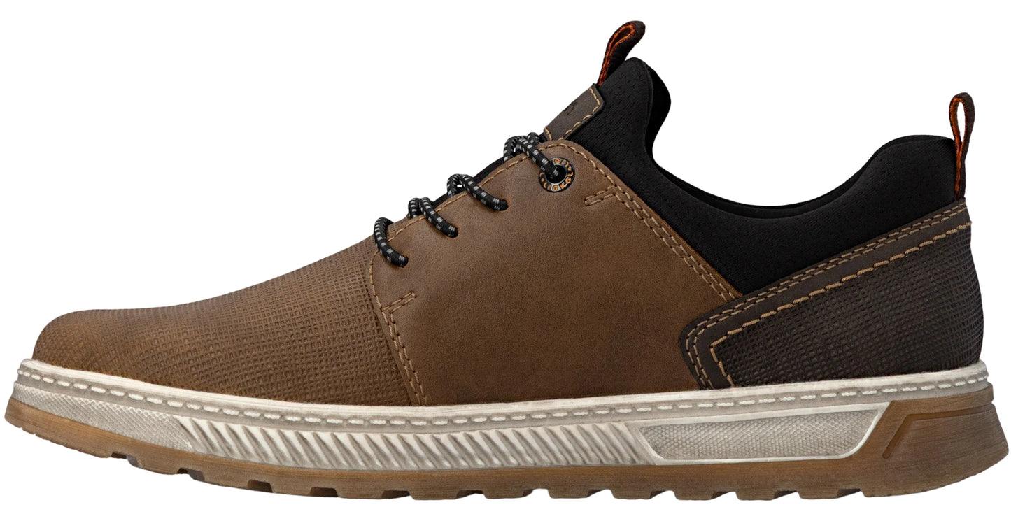 A brown and black casual sneaker with a textured brown fabric forefoot, smooth brown side panels, black collar, patterned laces, and a thick, ridged white midsole with a gum rubber outsole.