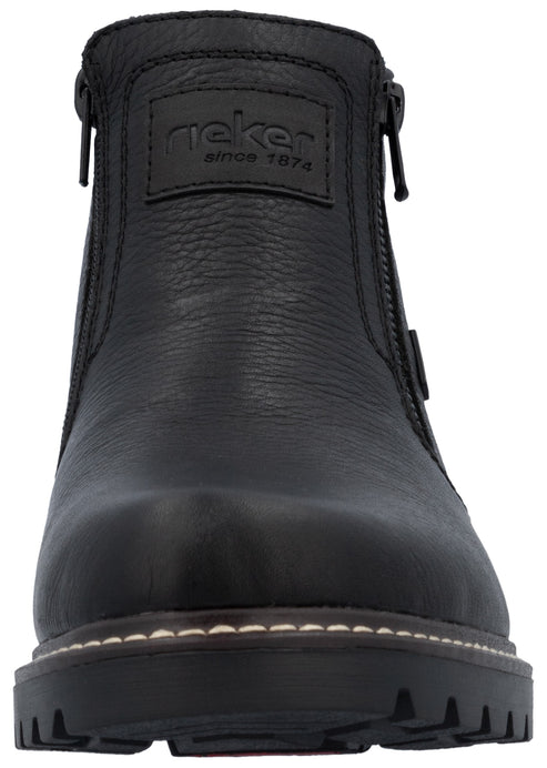 A black leather ankle boot with a rugged, lugged sole, visible stitching along the base, and zippers on both sides, featuring a textured brand patch on the upper front.