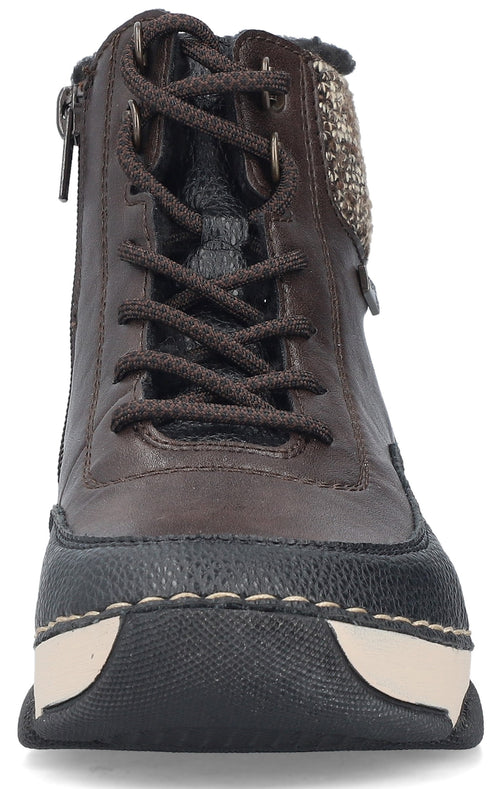 A brown leather ankle boot with laces, a textured knit cuff detail, a side zipper, and a black and cream chunky rubber outsole, viewed from the front.