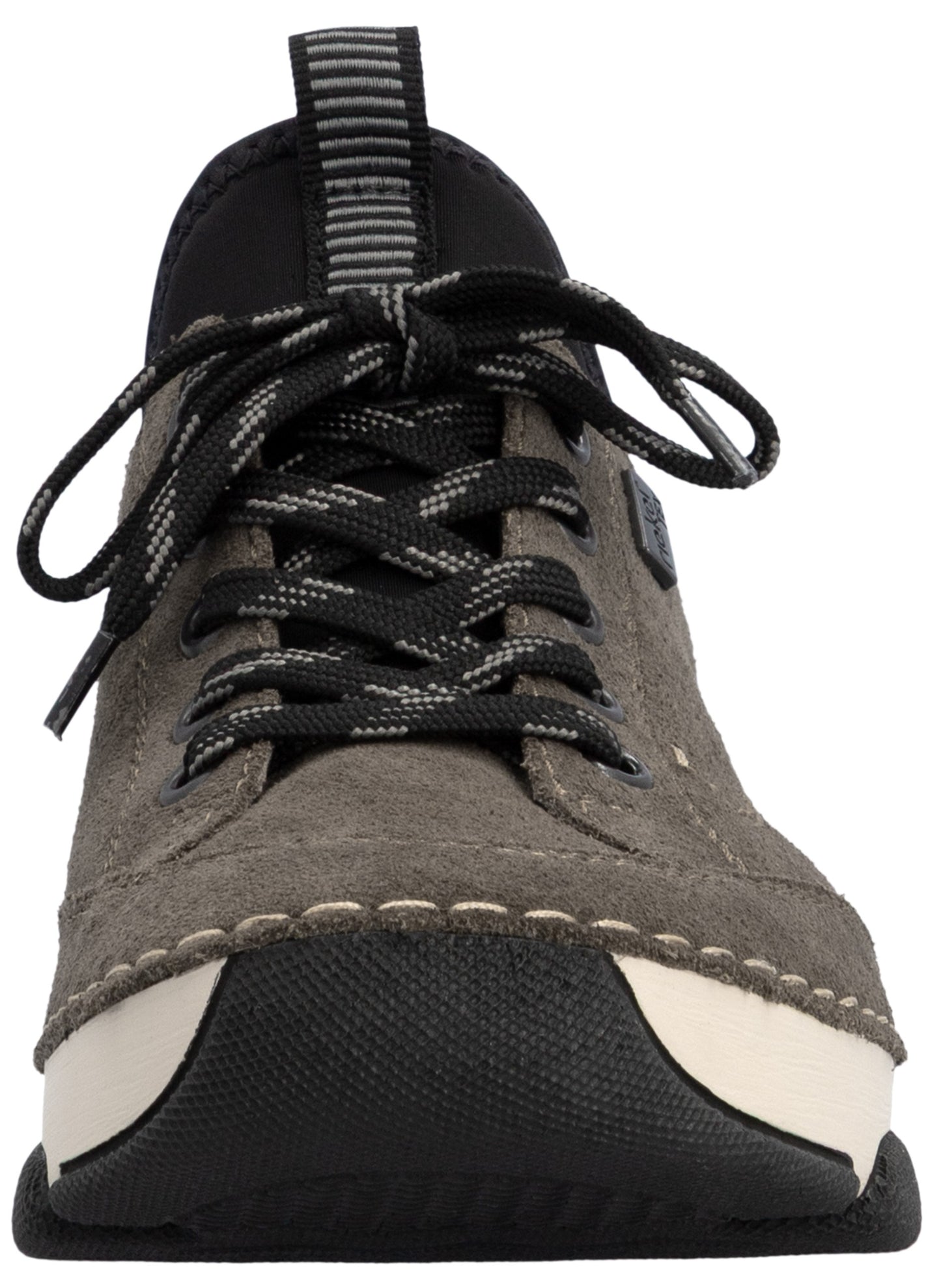 A gray suede sneaker with black laces, a prominent black toe bumper, and a thick, layered white and black rubber sole, viewed from the front.