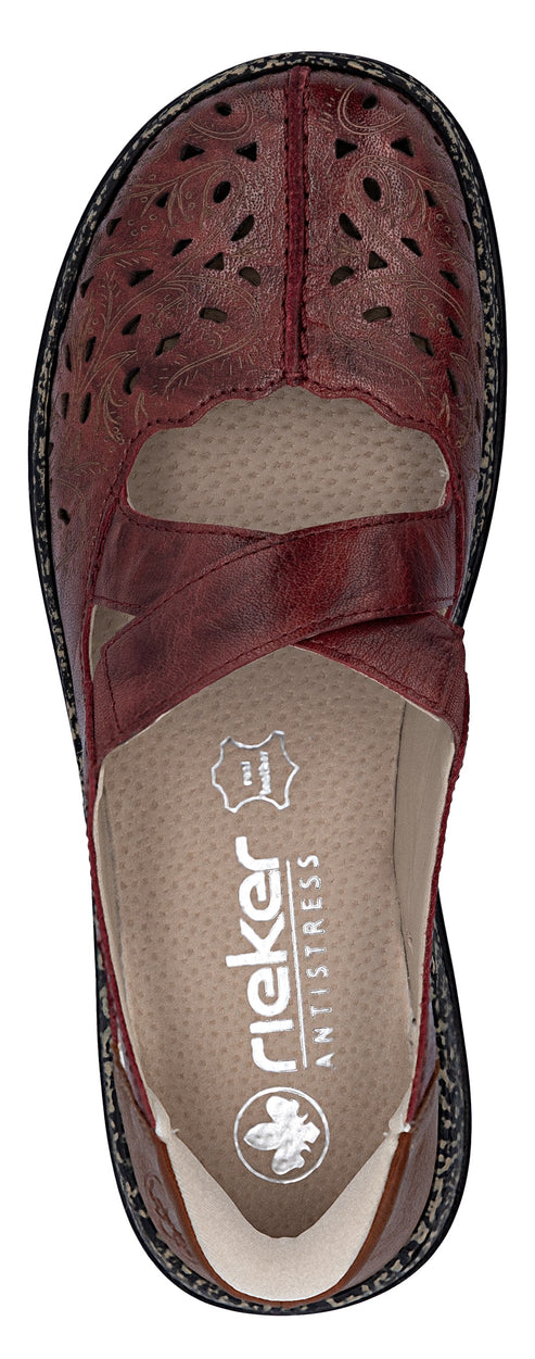 Burgundy criss-cross Mary Jane style shoe with decorative laser cut pattern and the word 'rieker' imprinted on the insole.