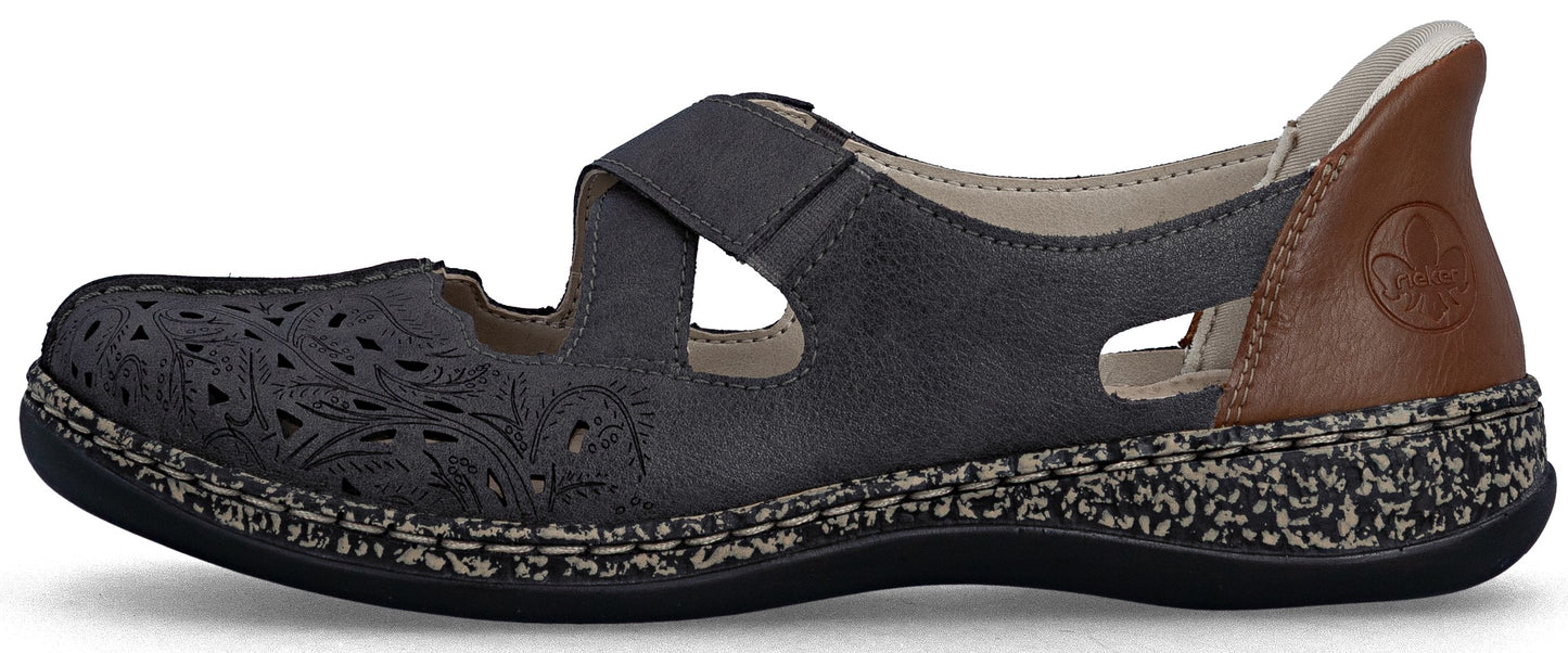 A gray shoe with a strap, decorative perforations, and a brown heel.