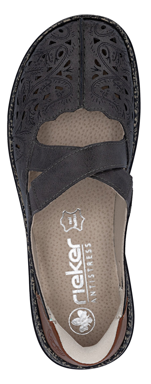 Black Mary Jane-style shoe with decorative cutouts and instep strap.