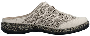 A cream-colored slip-on shoe with decorative perforations and a black sole.